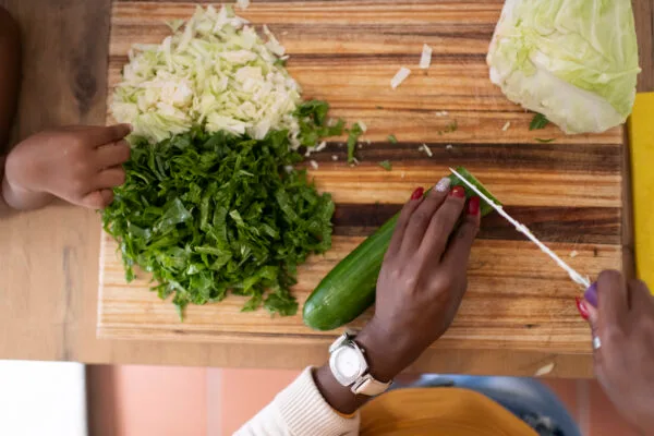 Mother chopping vegetables